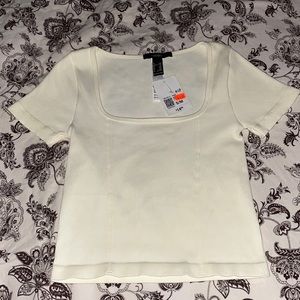 Selling top from forever 21 the size is S/M the color is cream white